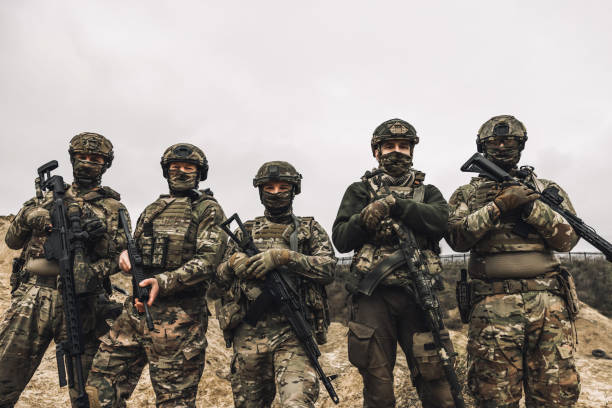 istock Soldiers on a shooting range looking concentrated and attentive 1455011016