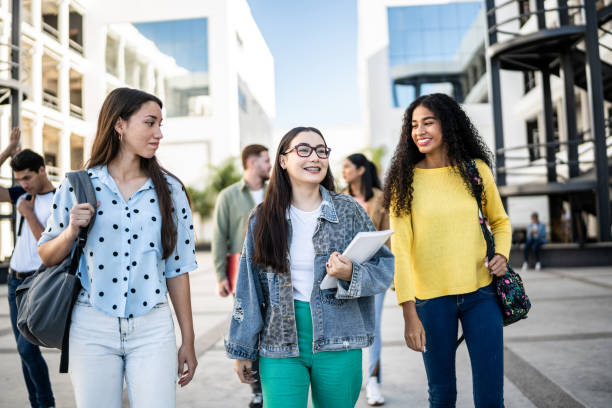 istock Young friends talking while arriving at university 1455011769