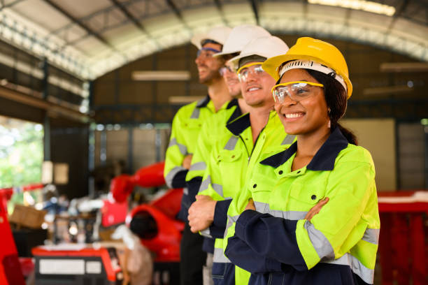 istock Group of confident engineers workers smiling standing at manufacturing factory 1455012223