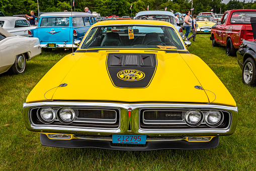 Iola, WI - July 07, 2022: High perspective front view of a 1971 Dodge Charger Super Bee Hardtop Coupe at a local car show.