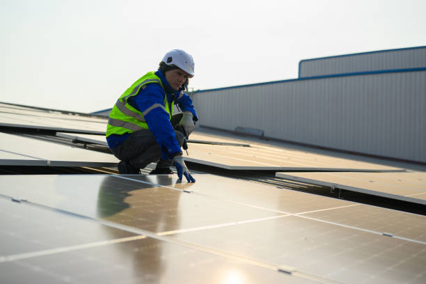 istock Professional technicians installing solar panels on rooftop of plant, Workers checking and operating system at solar cell farm power plant, Renewable energy source for electricity and power, Solar cell maintenance concept 1455019146
