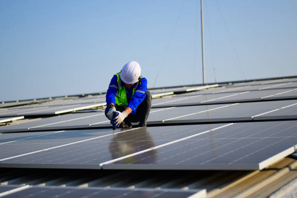 istock Professional technicians installing solar panels on rooftop of plant, Workers checking and operating system at solar cell farm power plant, Renewable energy source for electricity and power, Solar cell maintenance concept 1455019217