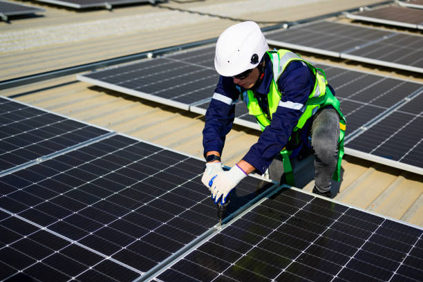 istock Professional engineer technician with safety helmet checking and operating system at solar cell farm power plant, Renewable energy source for electricity and power, Solar cell maintenance concept 1455020240