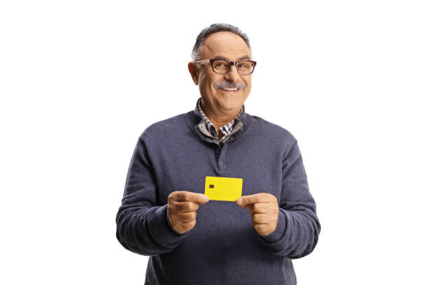 Uomo maturo felice in possesso di una carta di credito - foto stock