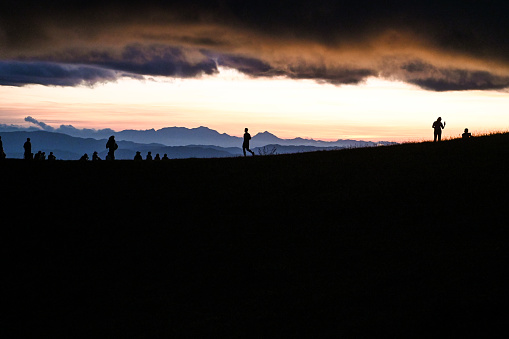 Silhouette of people on the mountain
