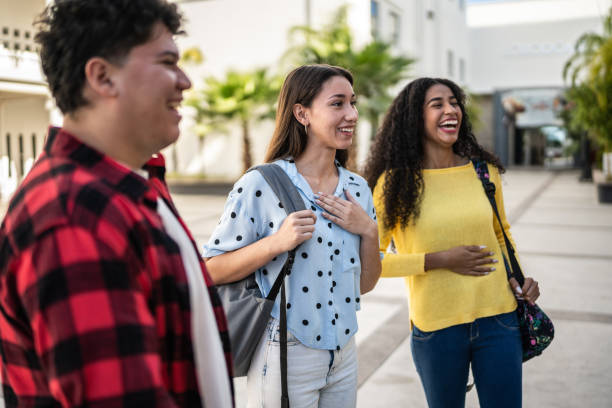 istock Young friends talking at university 1455025002