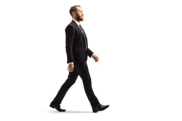 istock Professional man in a black suit walking 1455025013