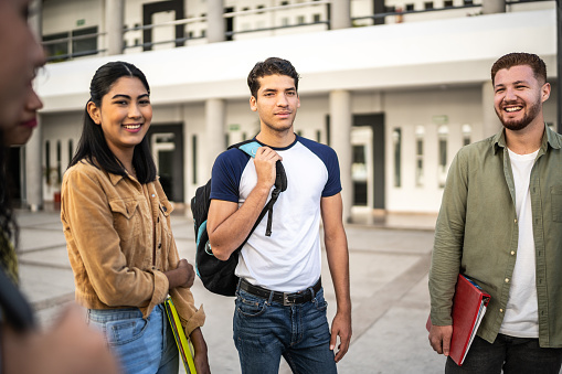 Young friends talking at university