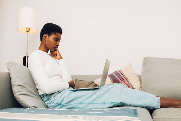 istock woman using laptop at home 1455025198