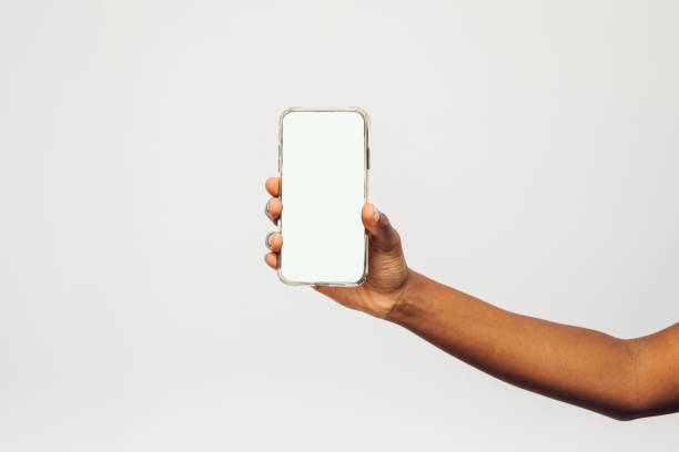 istock a hand holding smart phone 1455025423
