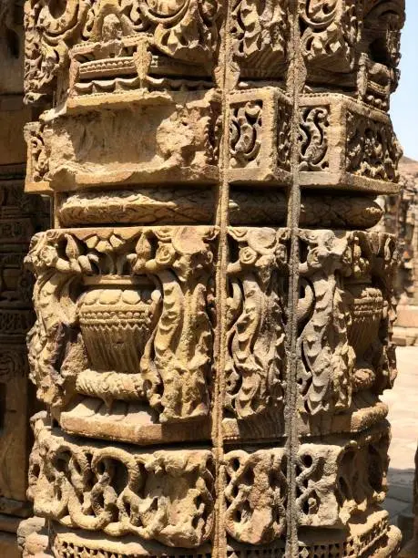 Photo of Pillars with beautiful carvings at the complex of Qutb Minar, Delhi.