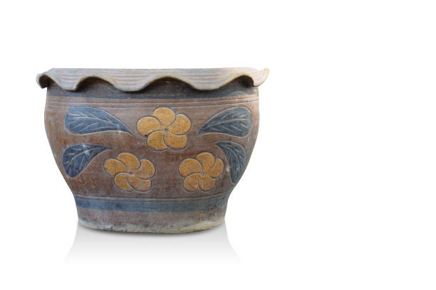 old large brown and yellow and black ceramic pot on blue background, object, decor, vintage, ancient, copy space