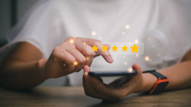 istock User give rating to service experience on online application, Customer review satisfaction feedback survey concept, Customer can evaluate quality of service leading to reputation ranking of business. 1455031170