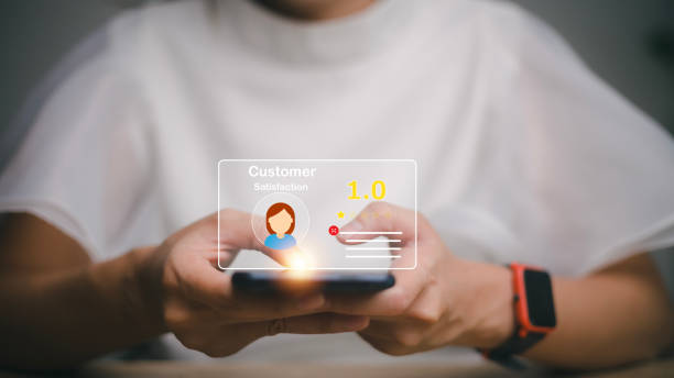 istock User give rating to service experience on online application, Customer review satisfaction feedback survey concept, Customer can evaluate quality of service leading to reputation ranking of business. 1455031172