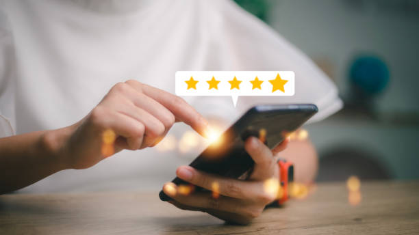 istock User give rating to service experience on online application, Customer review satisfaction feedback survey concept, Customer can evaluate quality of service leading to reputation ranking of business. 1455031177