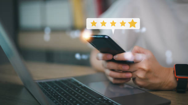 istock User give rating to service experience on online application, Customer review satisfaction feedback survey concept, Customer can evaluate quality of service leading to reputation ranking of business. 1455031182