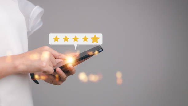 istock User give rating to service experience on online application, Customer review satisfaction feedback survey concept, Customer can evaluate quality of service leading to reputation ranking of business. 1455031189