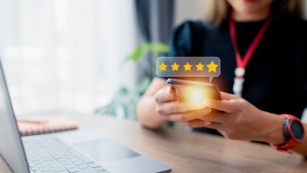 istock User give rating to service experience on online application, Customer review satisfaction feedback survey concept, Customer can evaluate quality of service leading to reputation ranking of business. 1455031201