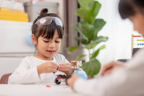 istock Asia students learn at home in coding robot cars and electronic board cables in STEM, STEAM, mathematics engineering science technology computer code in robotics for kids concept. 1455031278