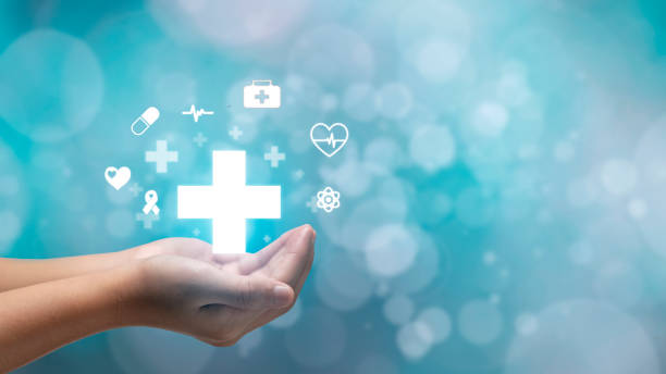 istock hand holding plus icon on blue background. Plus sign virtual means to offer positive thing like benefits, personal development, social network Profit,health insurance, growth concepts. 1455031383