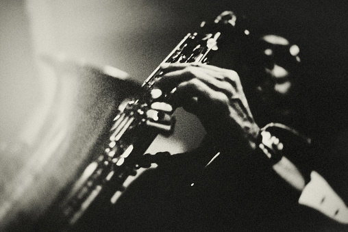 Portrait of a saxophone player in a jazz club.