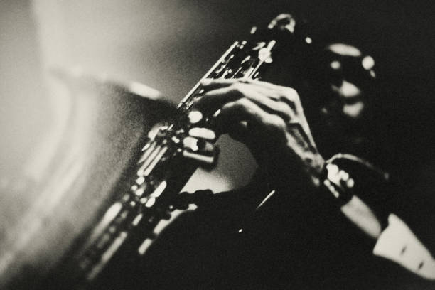 Jazz. Portrait of a saxophone player in a jazz club. sax arts and crafts stock pictures, royalty-free photos & images