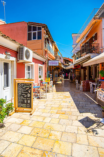 13 June 2022, The Paxos Island, Greece, Gaios beautiful cozy town, buildings, streets, doors, architecture, exteriors, flowers, balconies in summer