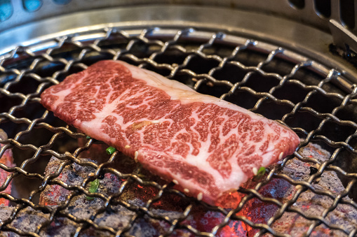 Japanese Wagyu Beef on BBQ charcoal grill stove