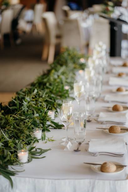 istock Vertical shot of green plants on an arranged dinner party table 1455038195