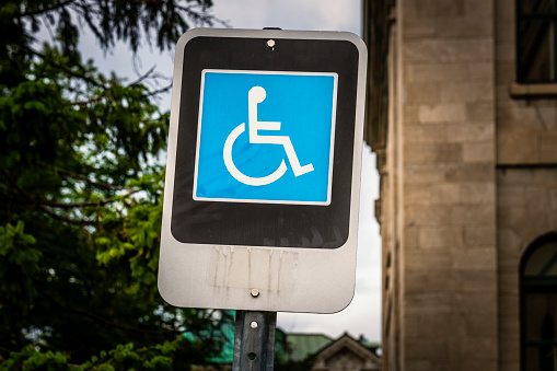 icon with man and handicap or wheelchair person symbol
