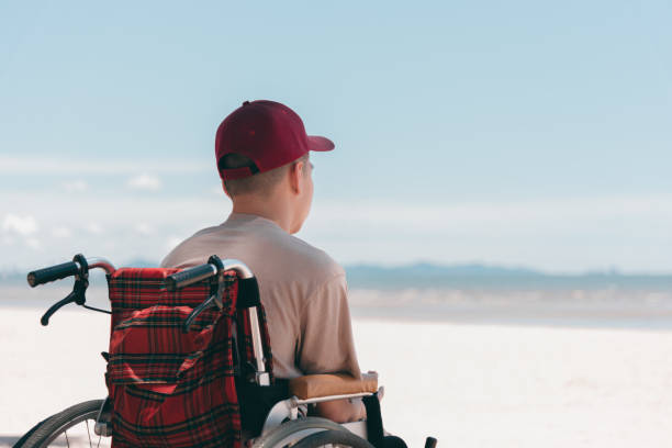 istock Activity outdoors on the beach background, Vacation with wheelchair. 1455038954