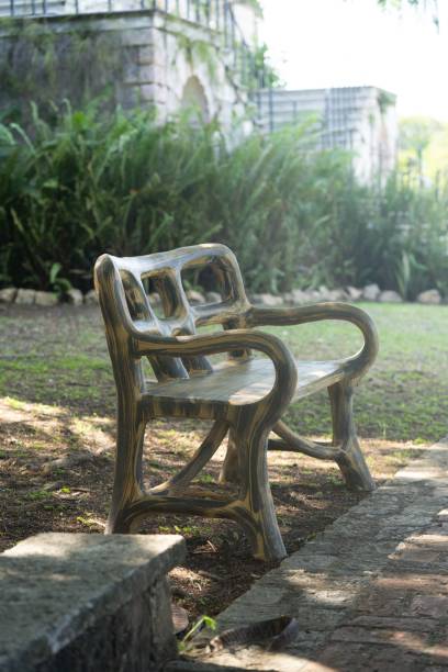 istock Vertical shot of a creative wooden bench in a park 1455040942