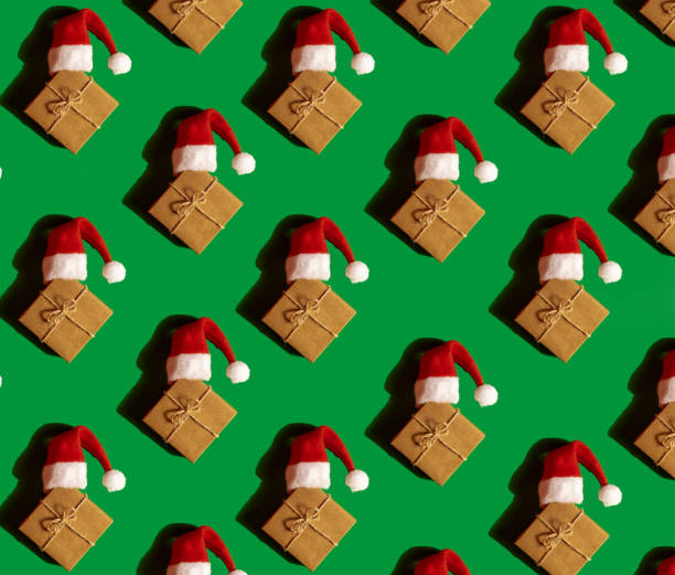 Stack of Christmas gift boxes wrapped in red, green, and gold paper with shiny bows and ribbons. Festive holiday background with bright colors, perfect for Christmas, New Year, and seasonal celebrations.