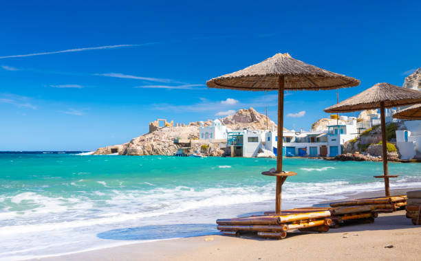 Beach and fishing village of Firapotamos on Milos island, Greece Beach and fishing village of Firapotamos on Milos island, Greece. High quality photo fish village stock pictures, royalty-free photos & images
