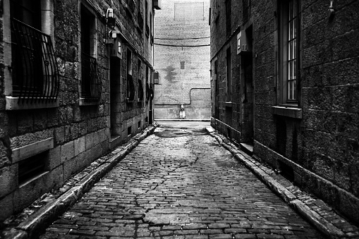 Dark alley in Vieux-Port de Montréal district. Montreal, Canada