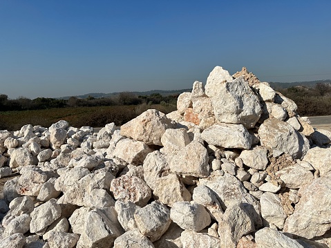 White stones prepared for making stone walls