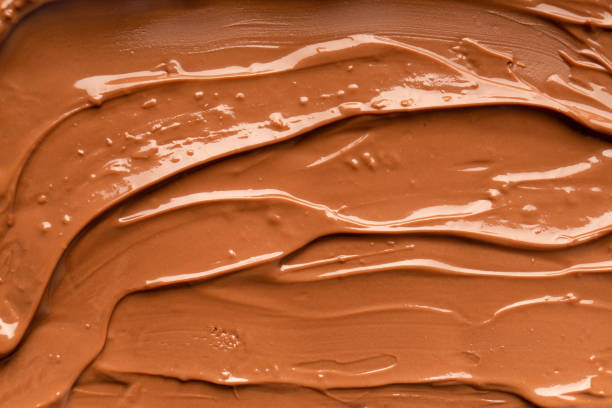 istock Chocolate background. Melted chocolate. Chocolate swirl. 1455051629