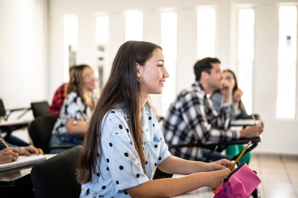 istock Young woman watching class at university 1455052660