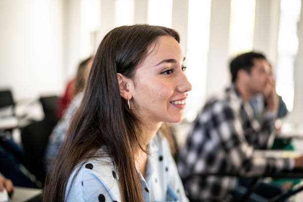 istock Young woman watching class at university 1455052680