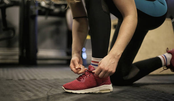 istock Girl exercising in gym 1455059504