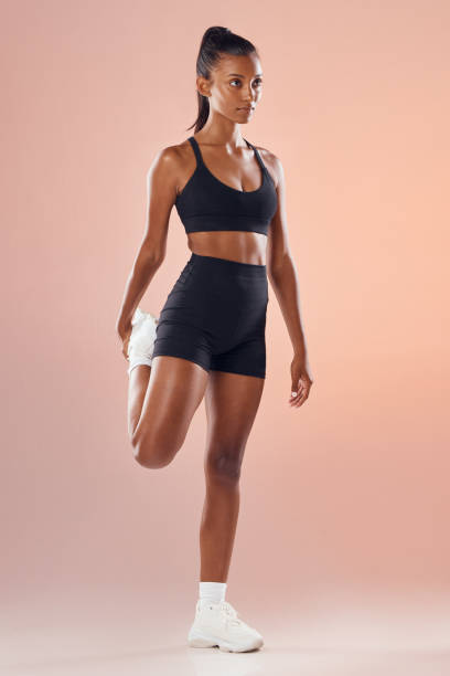 istock Fitness, exercise and workout athlete stretching out her legs before training indoors to stay healthy and young. Active, body and sporty woman warms up strong muscles for her motivated lifestyle 1455060141