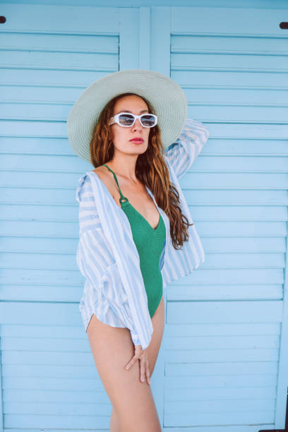 istock Beautiful young woman with typical  Mediterranean architecture 1455060803