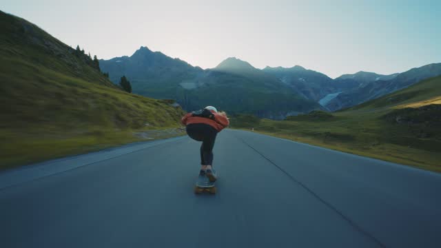 Woman doing downhill with longboard