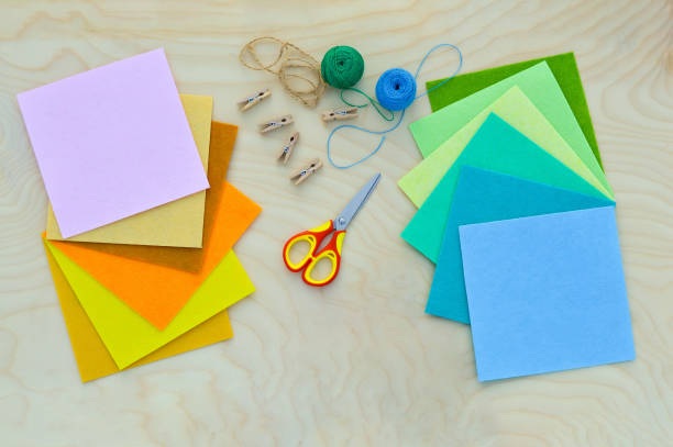 istock Hobby and colorful felt crafts. Workspace view. Sheets and crafts made of felt, scissors, threads and a needle for needlework. 1455061967