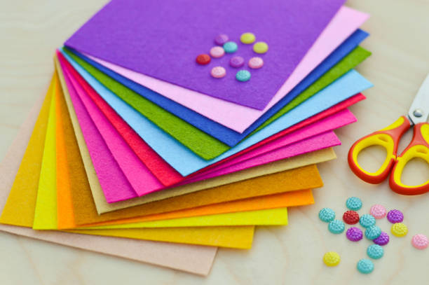 istock Hobby and colorful felt crafts. Workspace view. Sheets and crafts made of felt, scissors, threads and a needle for needlework. 1455061987