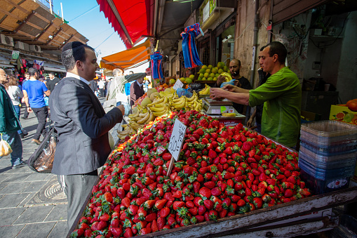2-26-2014 Jerusalem, Israel. Market in Jerusalem: strawberries in December (20 shekels per 1 kg: about 5 US dollars)