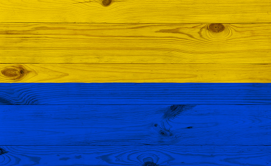 Flag of Ukraine drawing on wooden board. Art, business and patriotic concept. 3d rendering