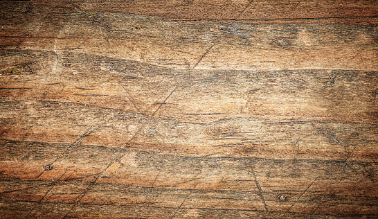 Background with wood texture. Top view of an old wooden table with cracks, scratches
