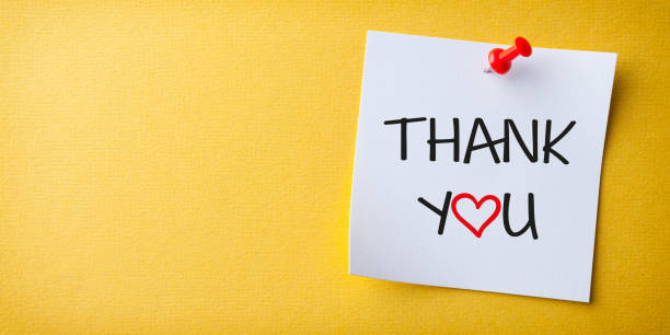 istock White Sticky Note With Thank You And Red Push Pin On Yellow Background 1455070724