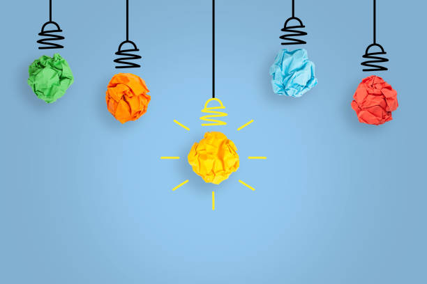 istock New Idea Concepts with Light Bulb Crumpled Paper on Blue Background 1455070906